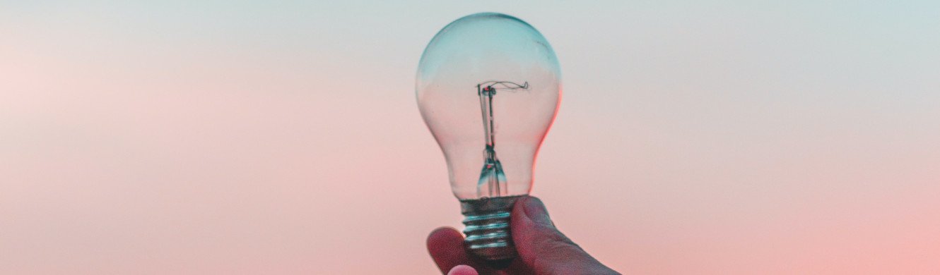 person holding lightbulb