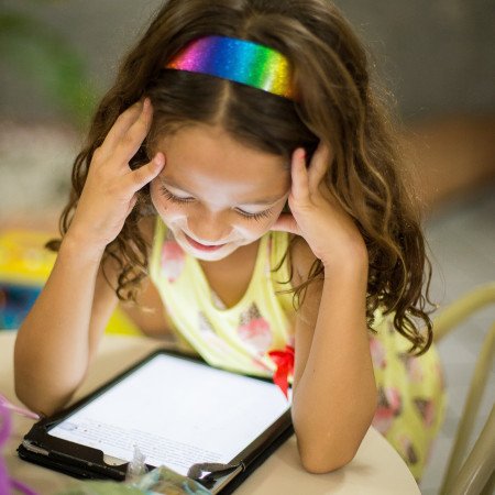 child looking at a tablet 