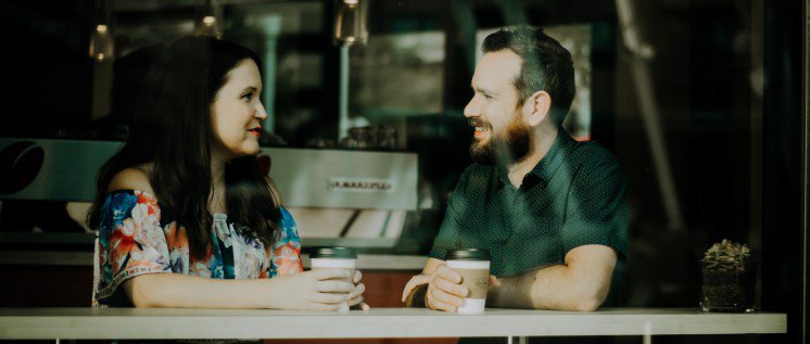 A couple talking in a coffee shop