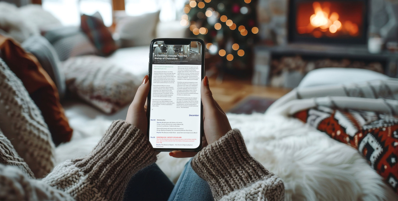 Person reading WePray on their phone