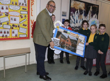 James Cleverly and school children.