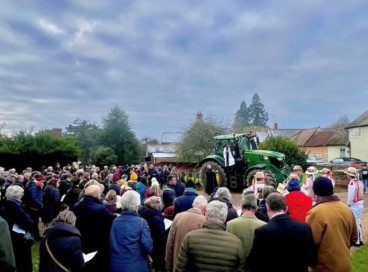 The Rev'd Canon Janet Nicholls blesses the plough from a tractor (photo Jon Wagstaff Photography) 