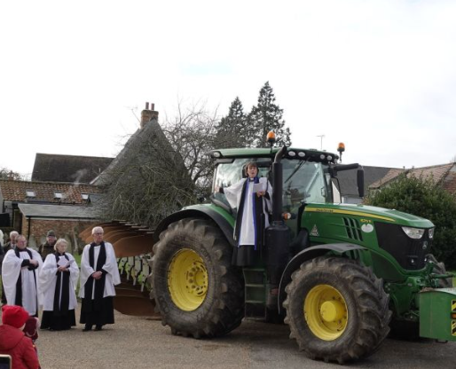 Priest on tractor